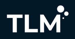 White TLM logo over black background