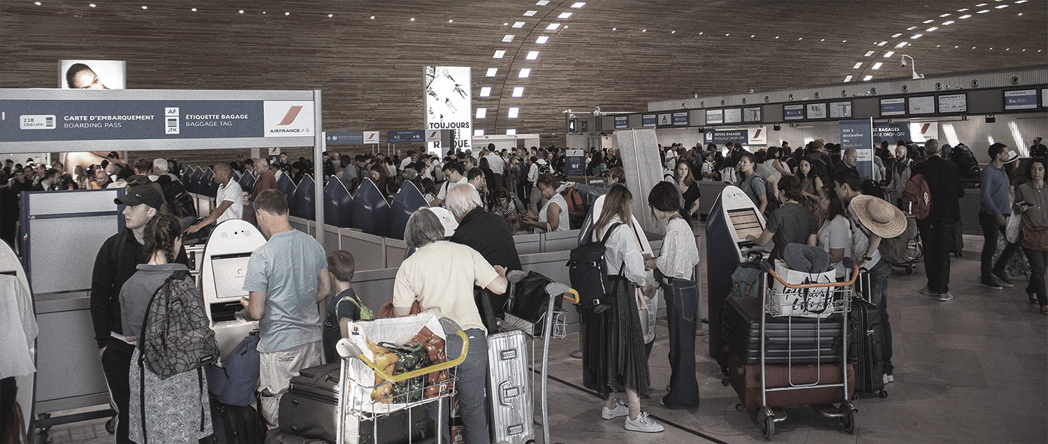 Photo of travelers waiting in lines at European airport